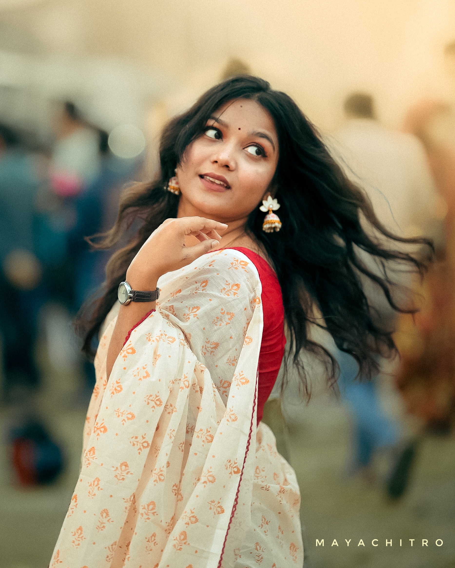 Bengali Woman in Red Saree with Flowing Hair Looking Back