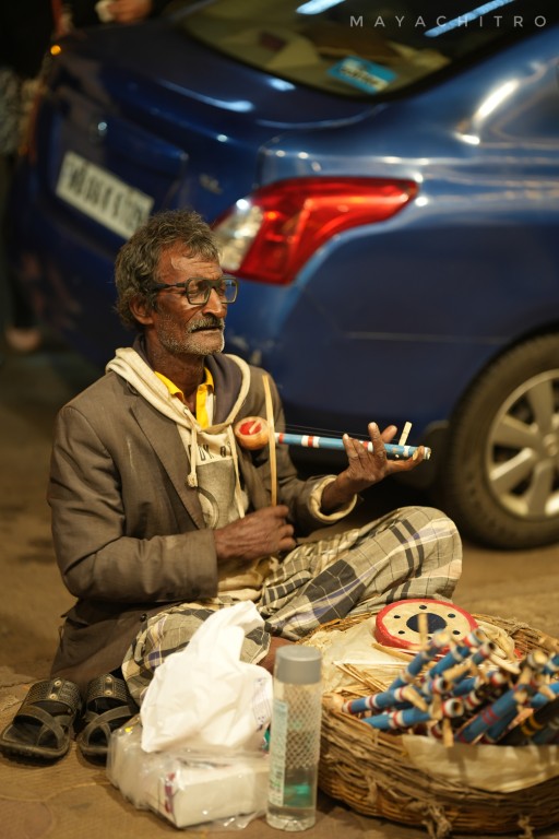 Old Man Selling Flutes at Indian Market Street Portrait