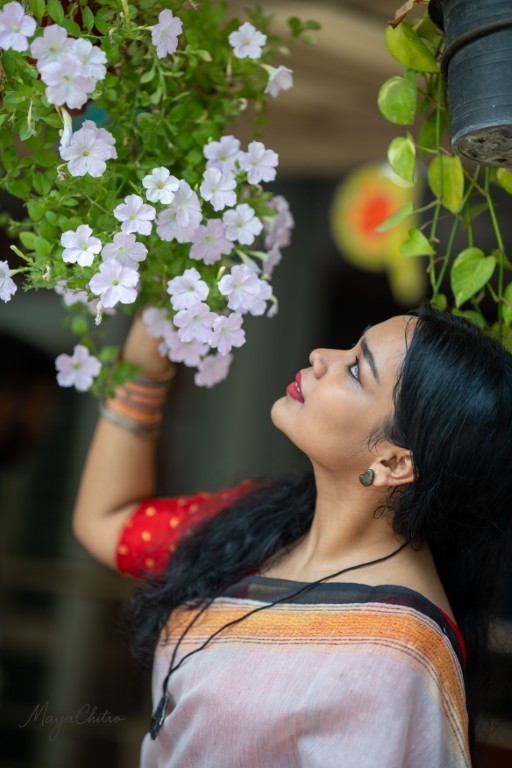 Woman Looking at Flowers